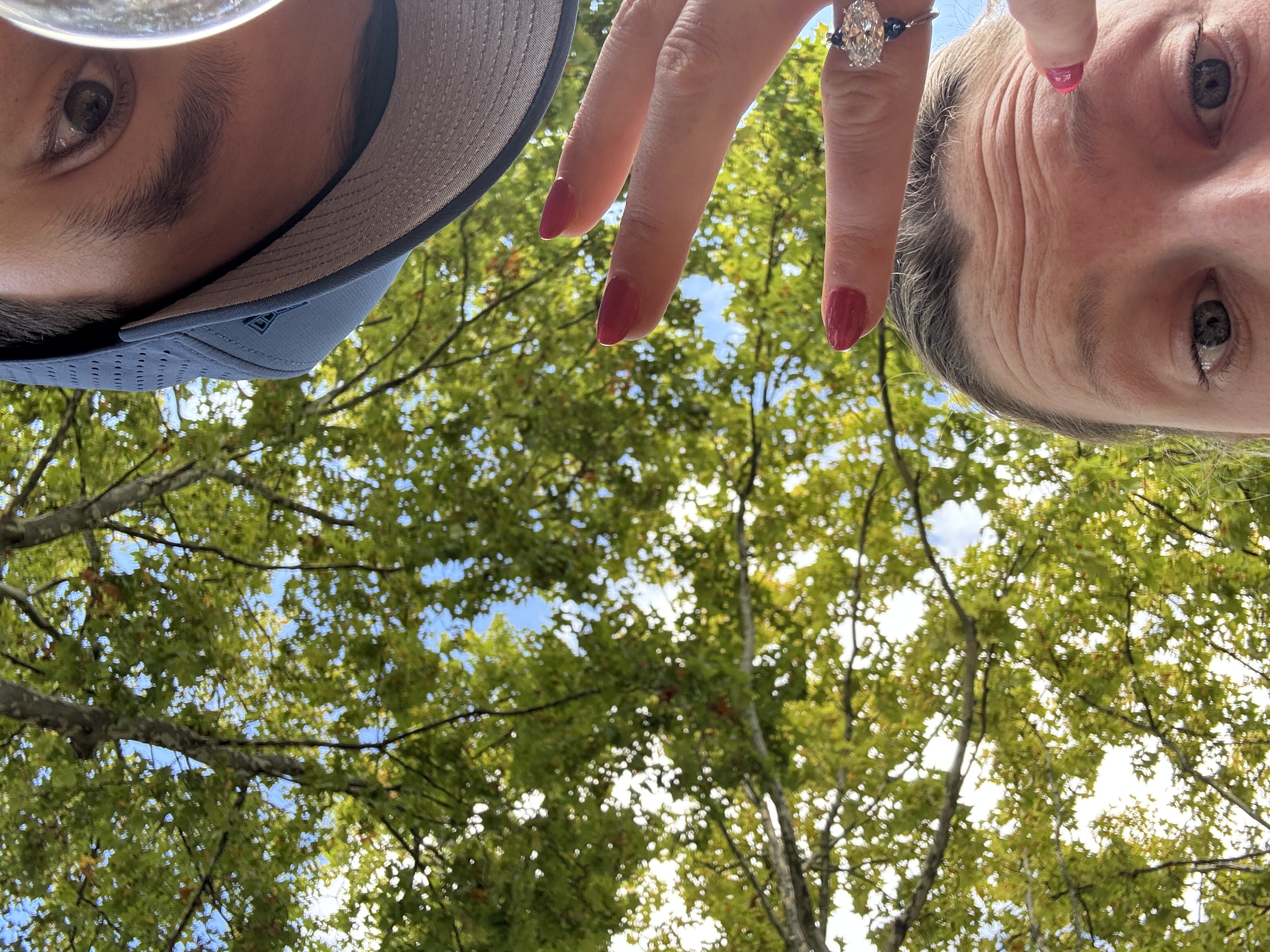 Michael and Devon showing the ring off on their engagement trip